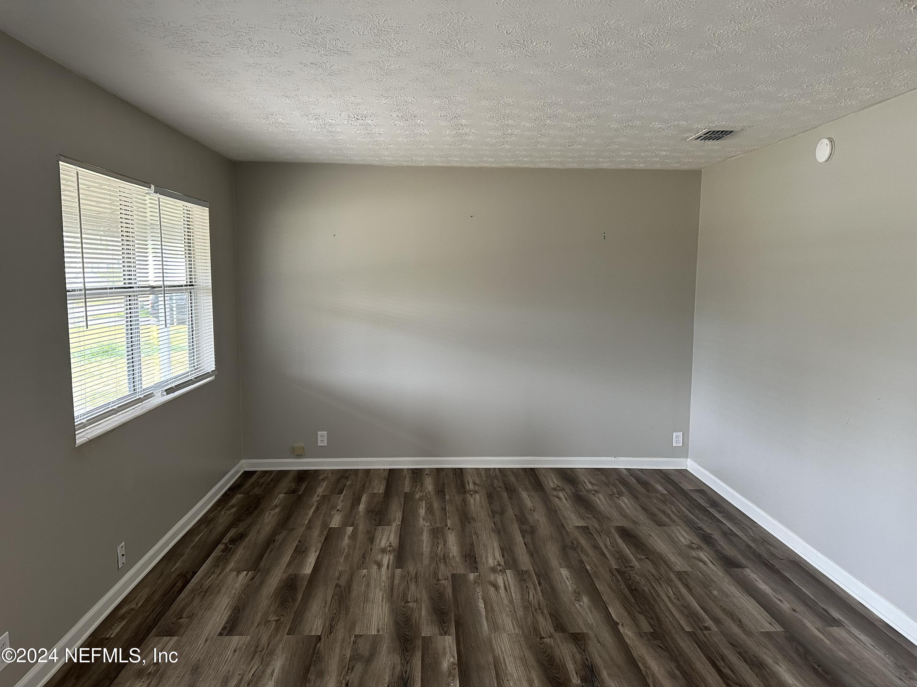 7417 Coral Sea Road Jacksonville, FL 32244 - Photo 3 of 10 wooden floor in a room