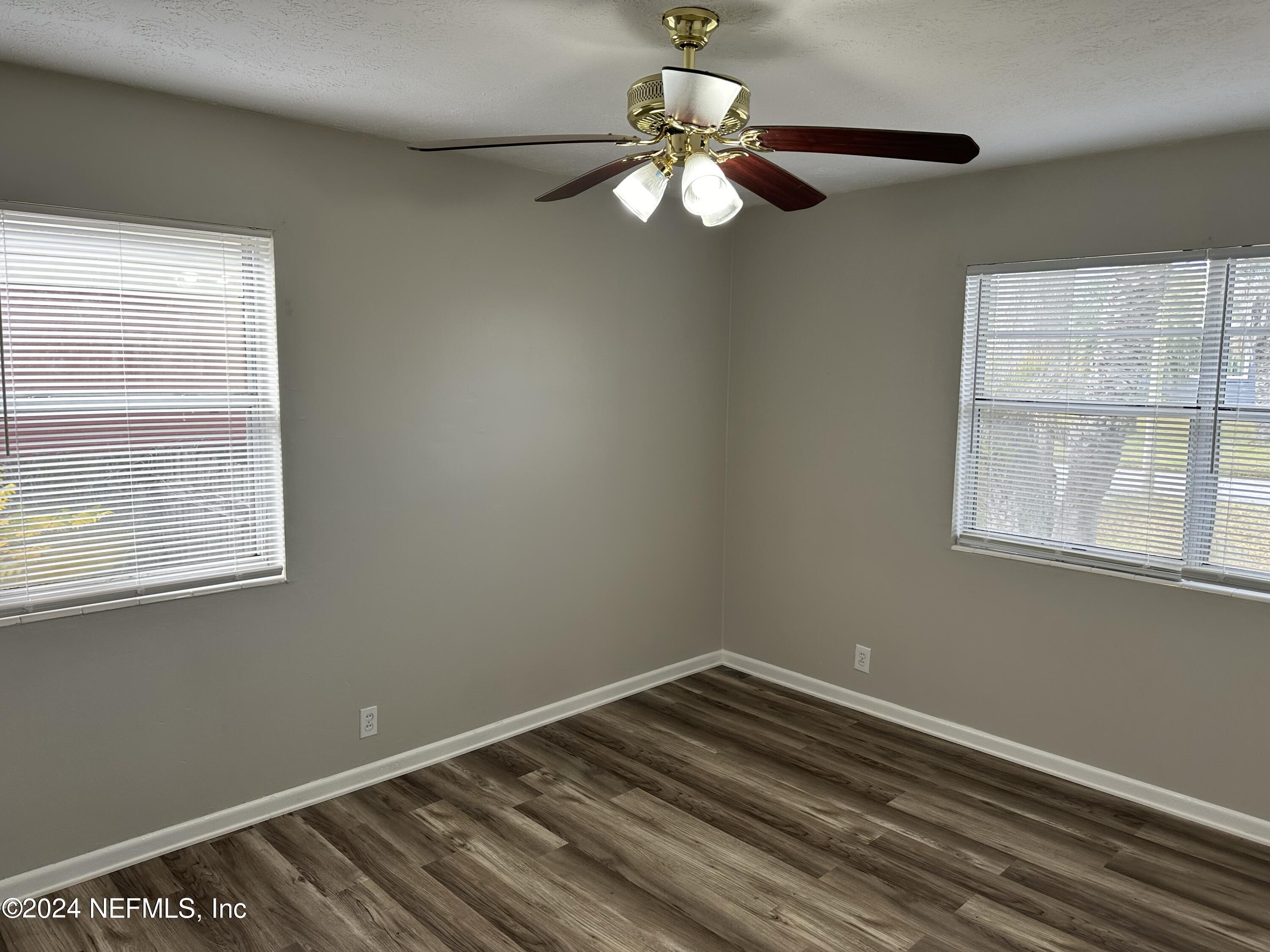 7417 Coral Sea Road Jacksonville, FL 32244 - Photo 9 of 10 a view of room with window and ceiling fan