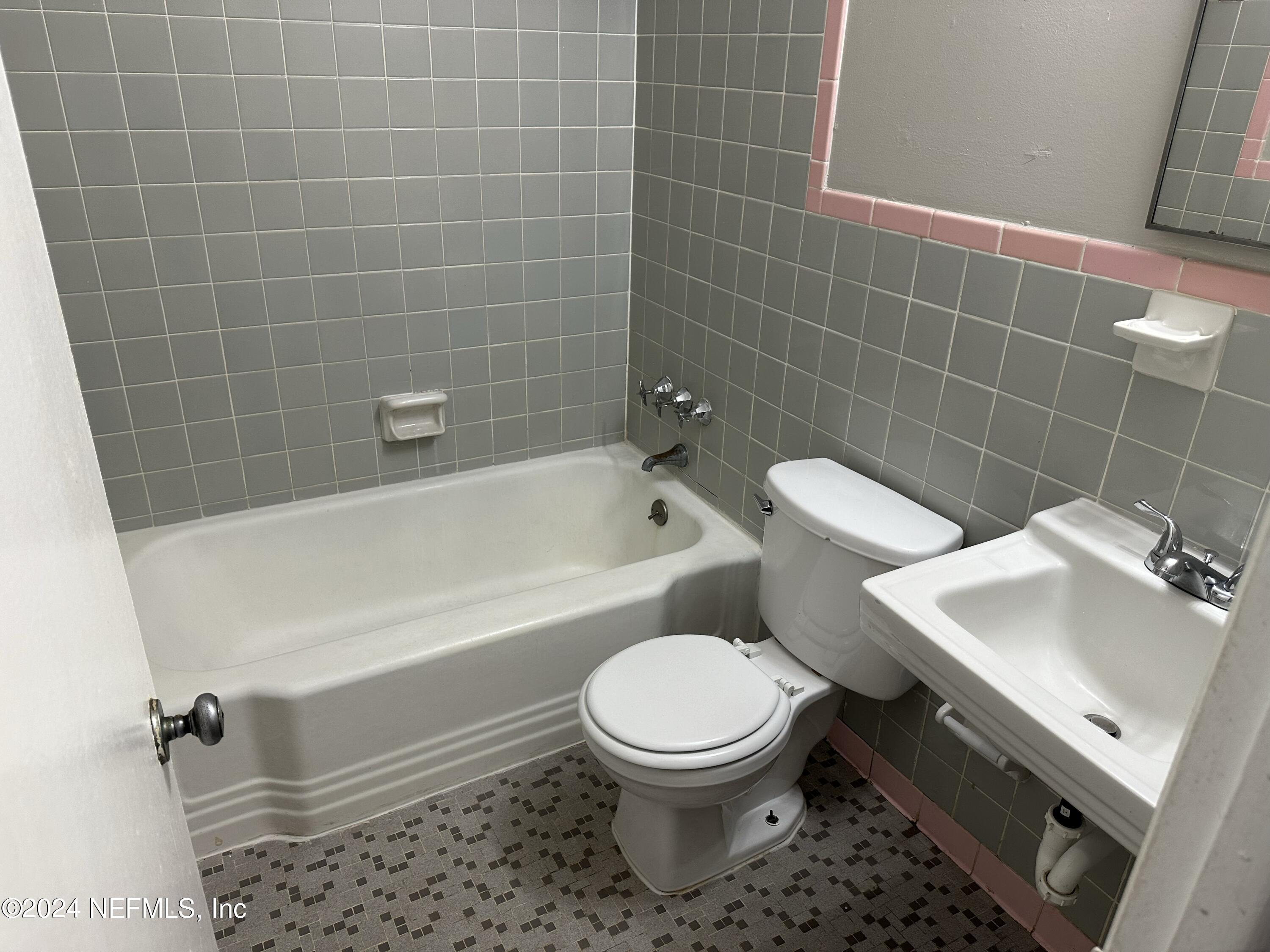 7417 Coral Sea Road Jacksonville, FL 32244 - Photo 10 of 10 a bathroom with a sink toilet and shower