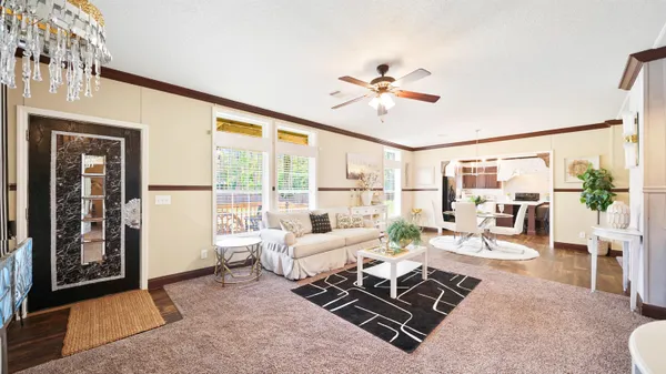 a living room with furniture fireplace and a flat screen tv