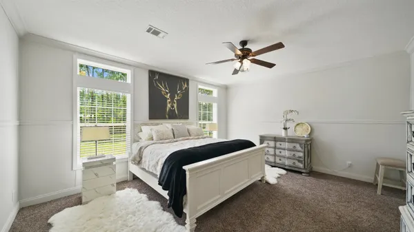 a bedroom with a bed and a view of bathroom