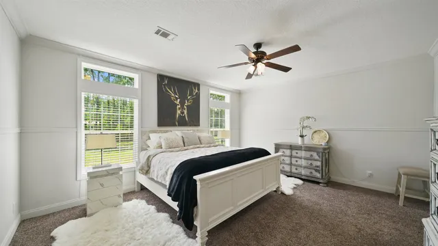 a bedroom with a bed and a view of bathroom
