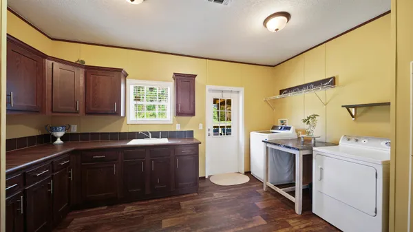 a view of hallway with wooden floor