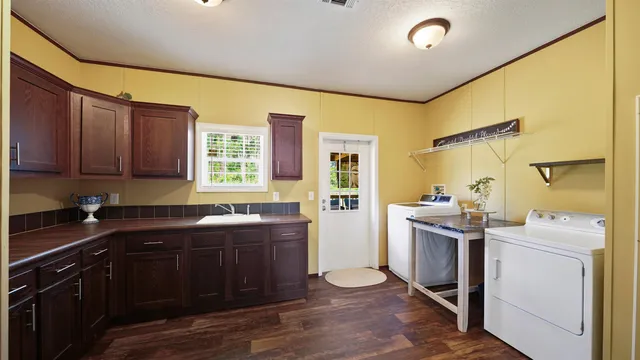 a view of hallway with wooden floor