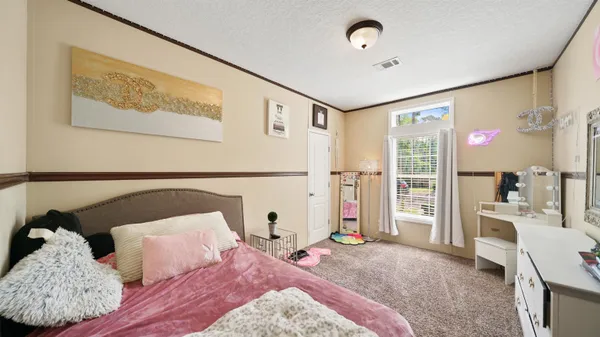 a balcony with furniture and garden view
