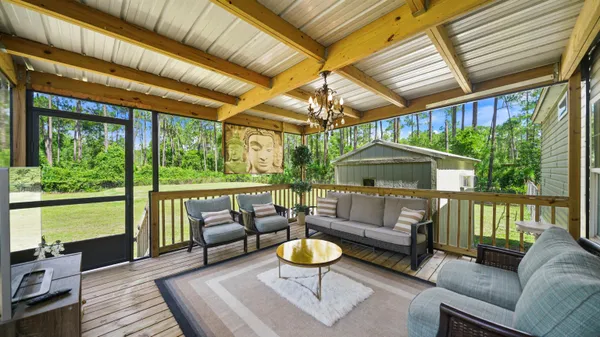 a balcony with table and chairs