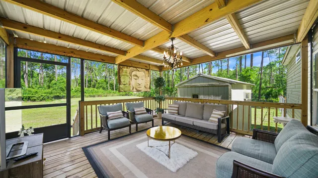 a balcony with table and chairs