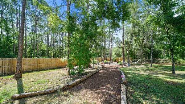 a garden with flowers and lots of green space