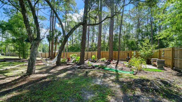 a backyard of a house with lots of green space
