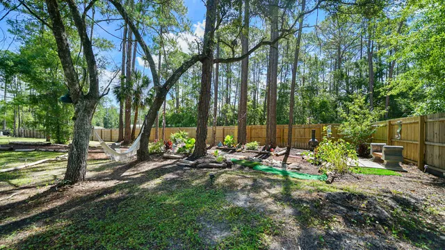 a backyard of a house with lots of green space