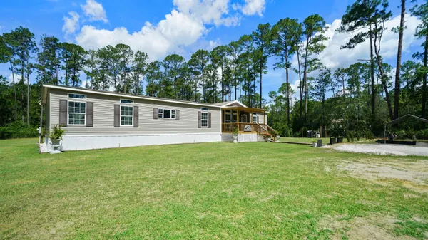 a front view of house with a yard
