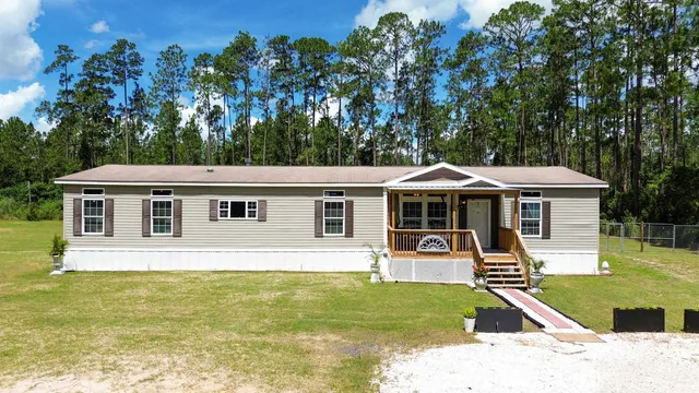 an aerial view of residential house with outdoor space