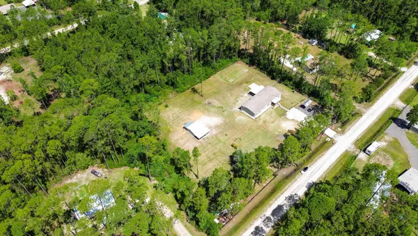 a black and white photo of a bench