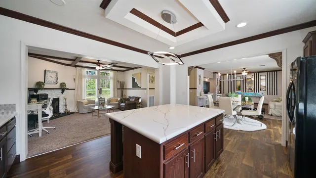 a open kitchen with stainless steel appliances kitchen island a large island in the center