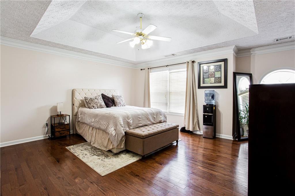 20 Trelawney Run Covington, GA 30016 - Photo 18 of 26 a bedroom with a bed dresser and a window