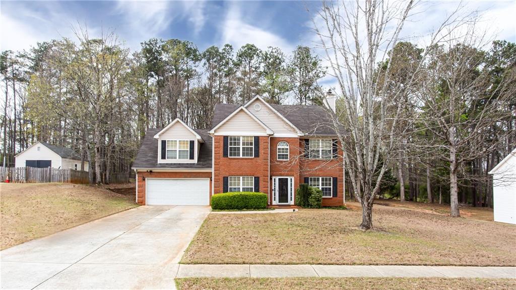 20 Trelawney Run Covington, GA 30016 - Photo 2 of 26 a view of a yard in front of house