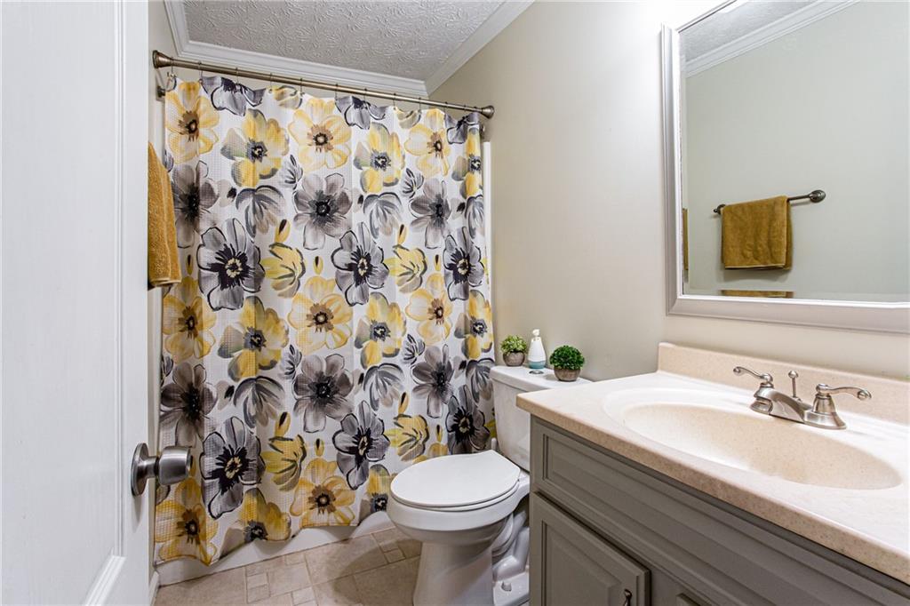 20 Trelawney Run Covington, GA 30016 - Photo 23 of 26 a bathroom with a sink and a toilet