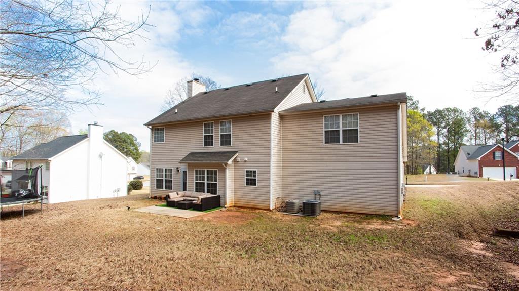 20 Trelawney Run Covington, GA 30016 - Photo 25 of 26 a front view of a house with a yard