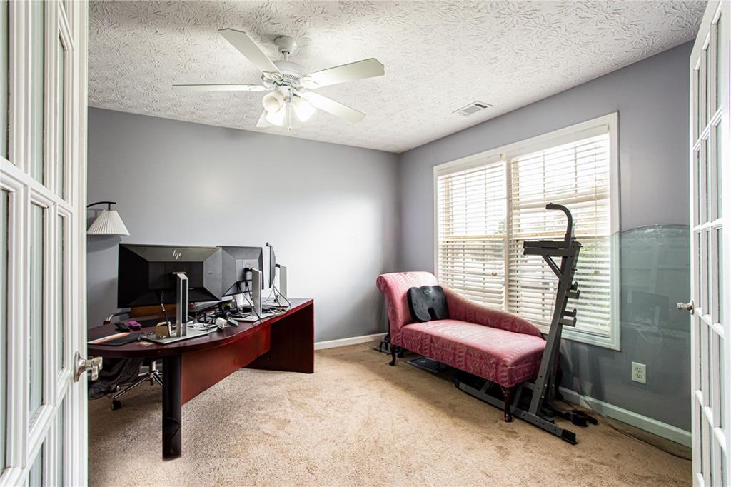 20 Trelawney Run Covington, GA 30016 - Photo 6 of 26 a living room with furniture and a window