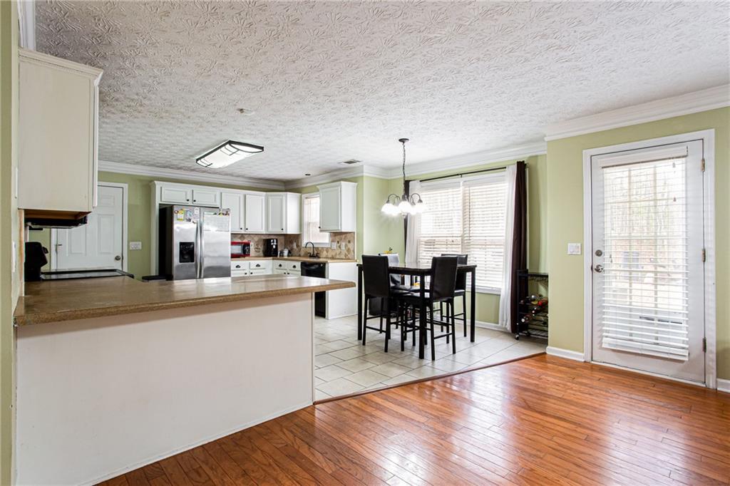 20 Trelawney Run Covington, GA 30016 - Photo 10 of 26 a kitchen with lots of counter and chairs