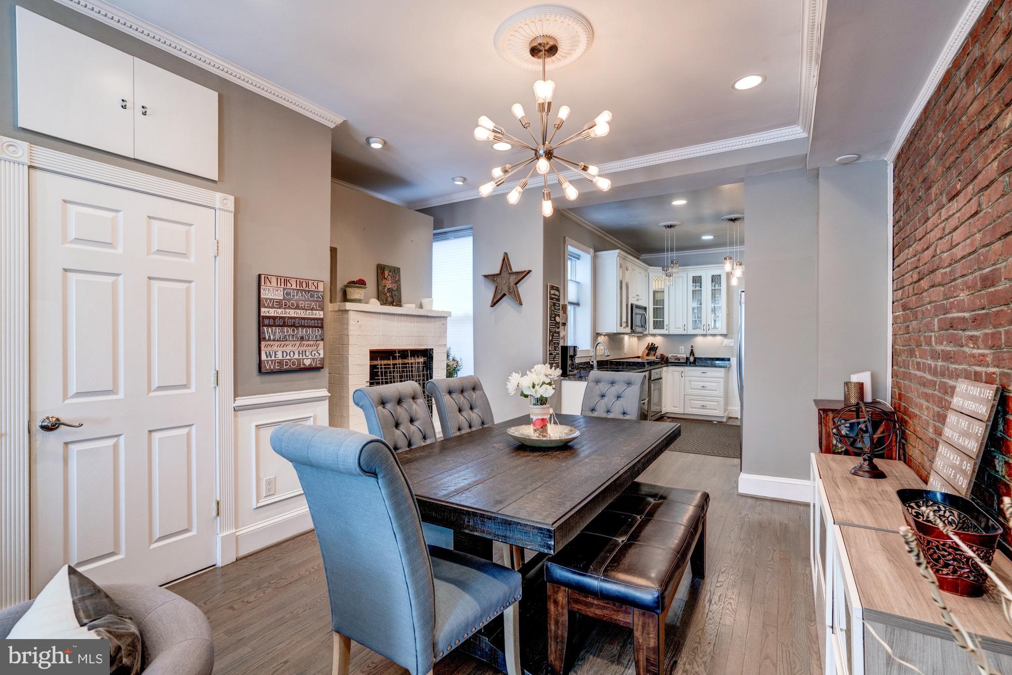 1016 G Street Southeast Washington, DC 20003 - Photo 12 of 56 a view of a dining room with furniture and wooden floor