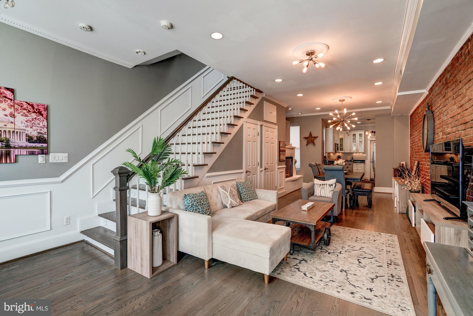 1016 G Street Southeast Washington, DC 20003 - Photo 18 of 56 a living room with furniture and a flat screen tv