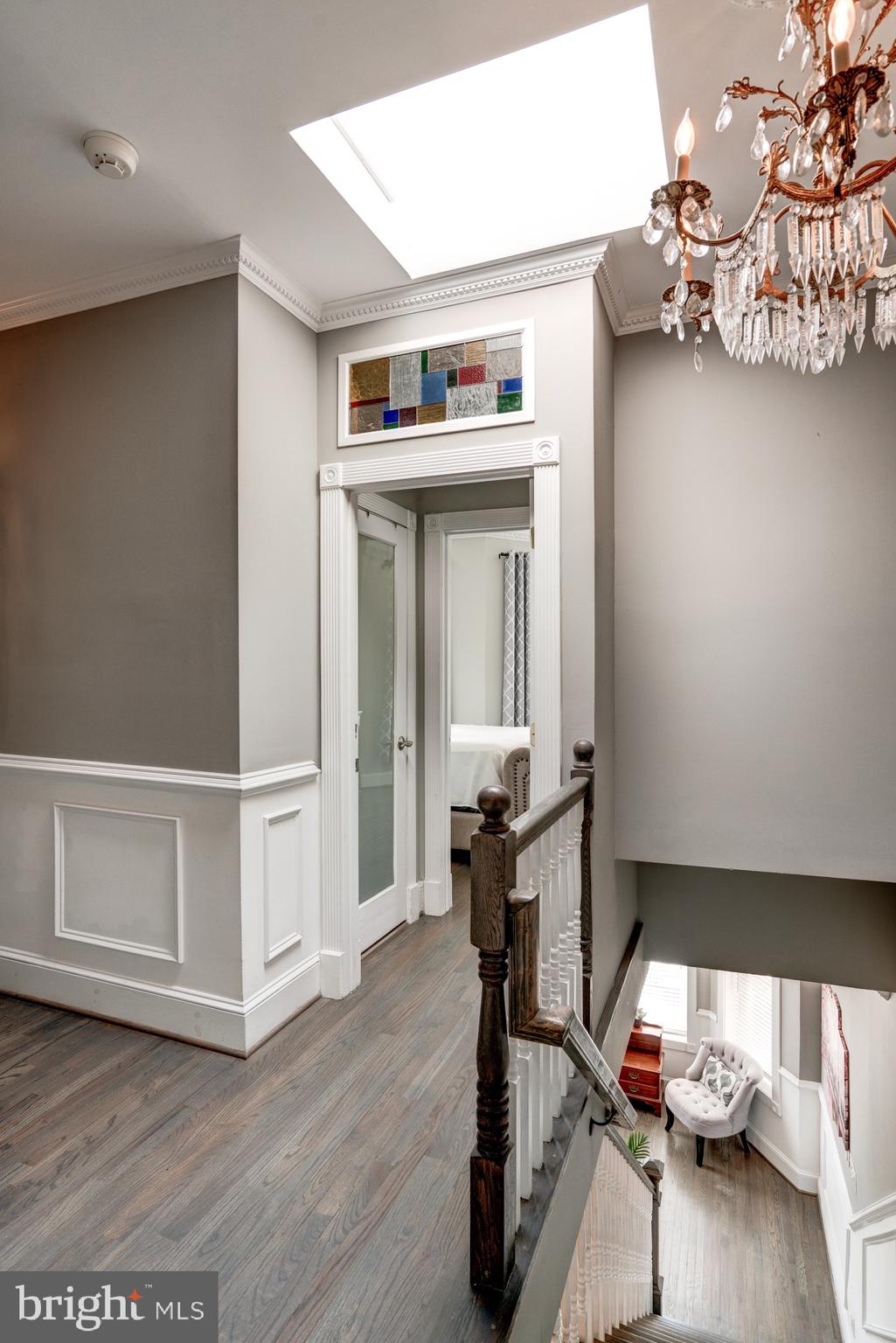1016 G Street Southeast Washington, DC 20003 - Photo 27 of 56 a view of a workspace with furniture and a wooden floor