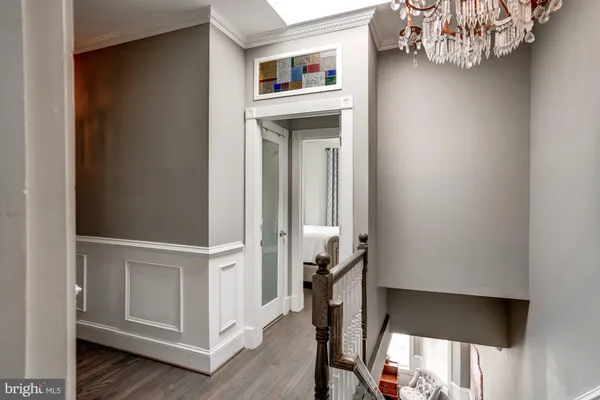 a view of front door with wooden floor