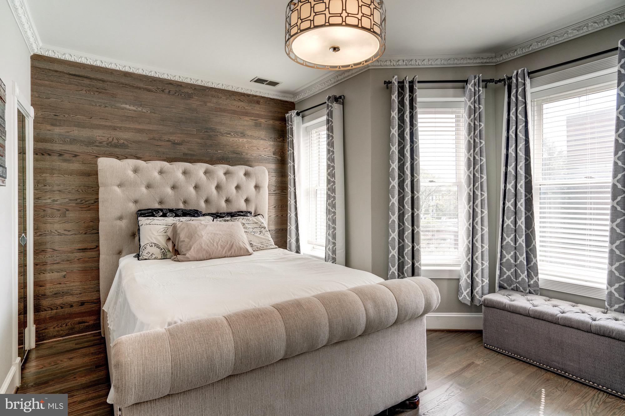 1016 G Street Southeast Washington, DC 20003 - Photo 30 of 56 a bedroom with a bed and a large window