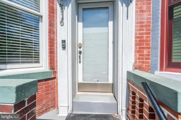 a view of a door and a window