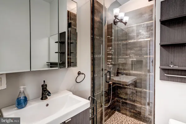 a bathroom with a sink and a mirror