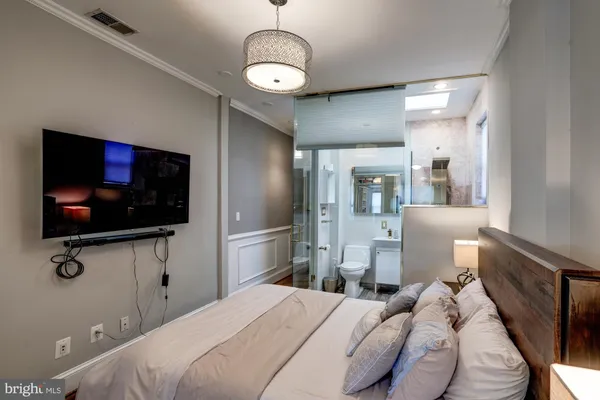 a bathroom with a bathtub and a sink