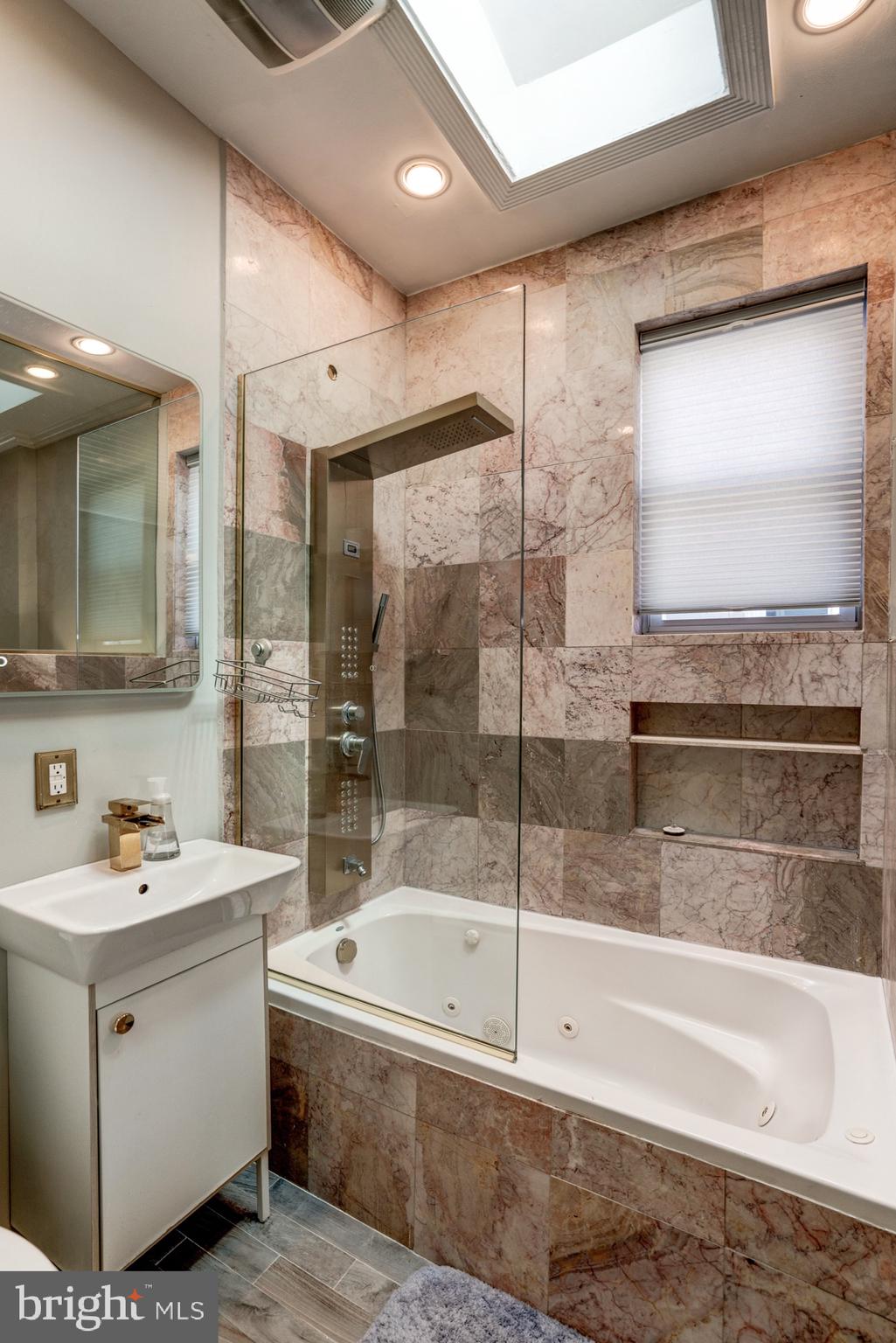 1016 G Street Southeast Washington, DC 20003 - Photo 40 of 56 a bathroom with a bathtub and a sink