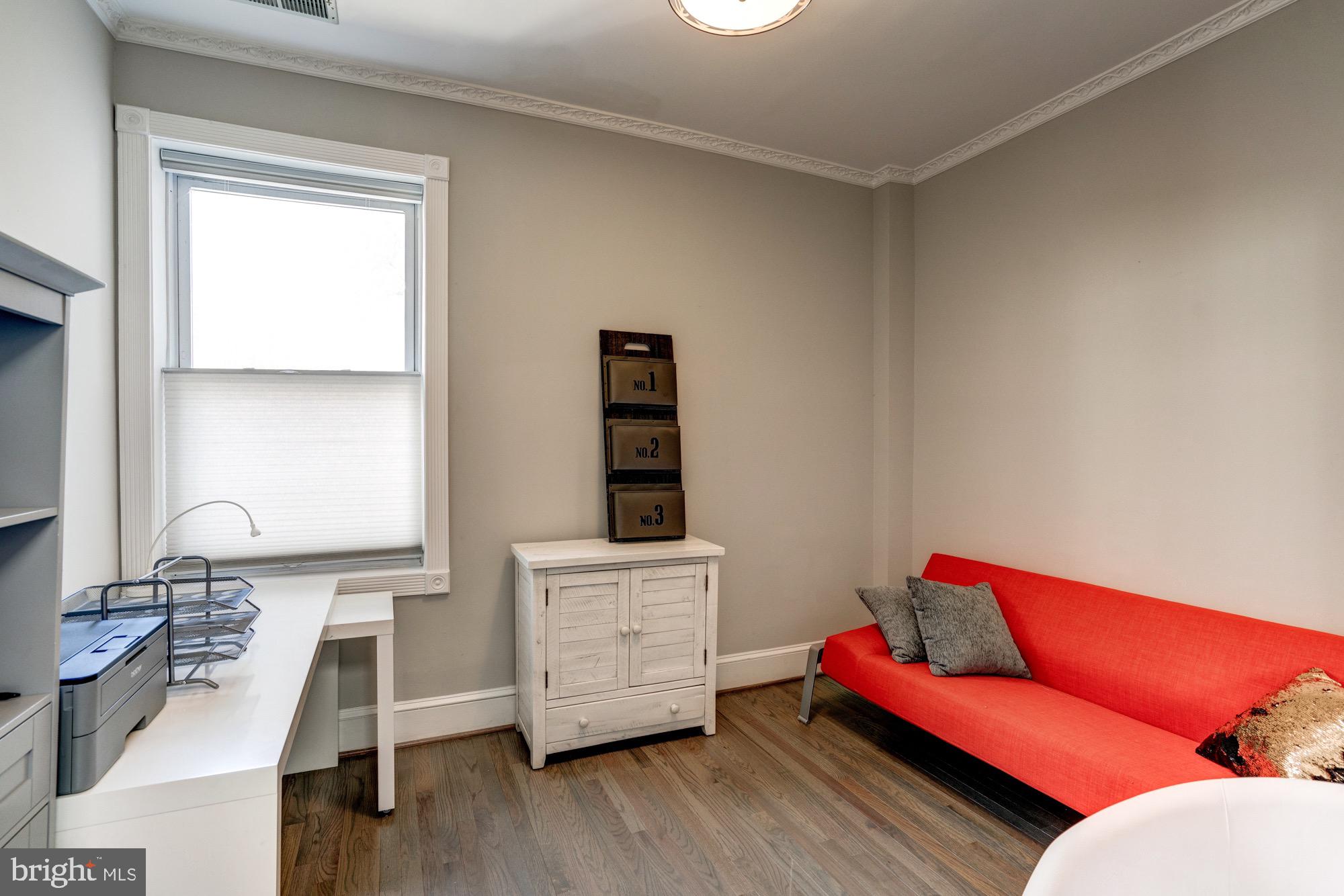 1016 G Street Southeast Washington, DC 20003 - Photo 41 of 56 a living room with furniture and wooden floor