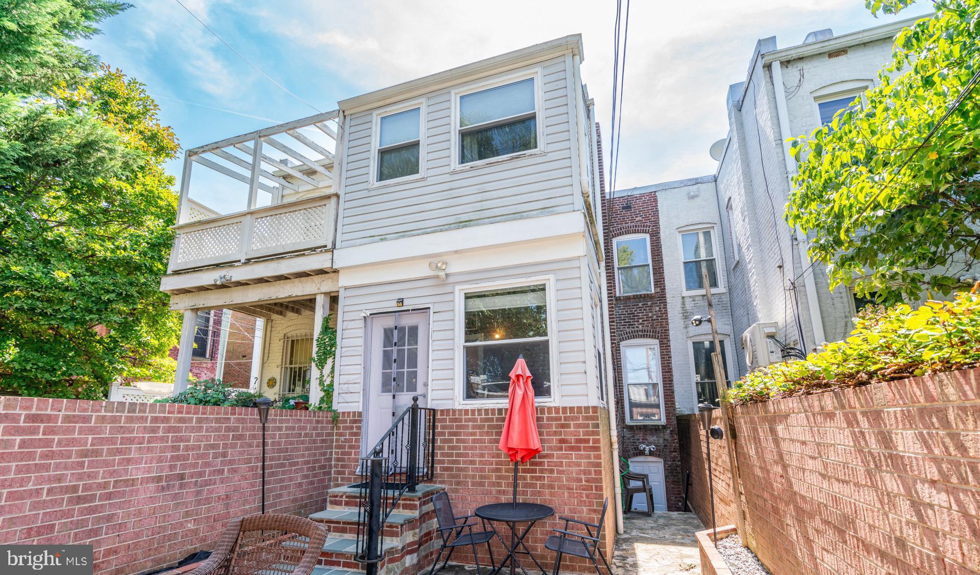 1016 G Street Southeast Washington, DC 20003 - Photo 45 of 56 a view of a patio with table and chairs and potted plants