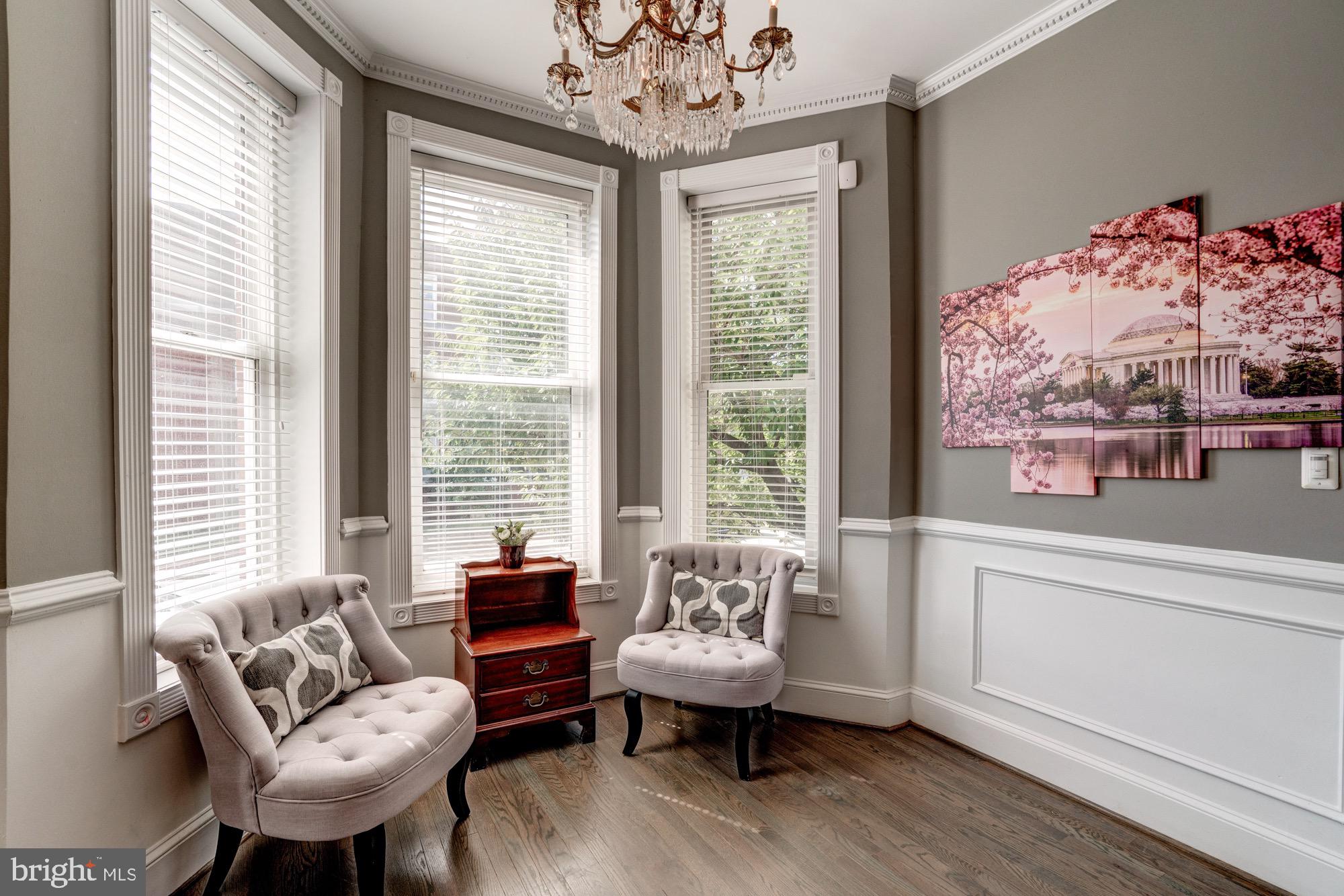 1016 G Street Southeast Washington, DC 20003 - Photo 6 of 56 a living room with furniture and a large window