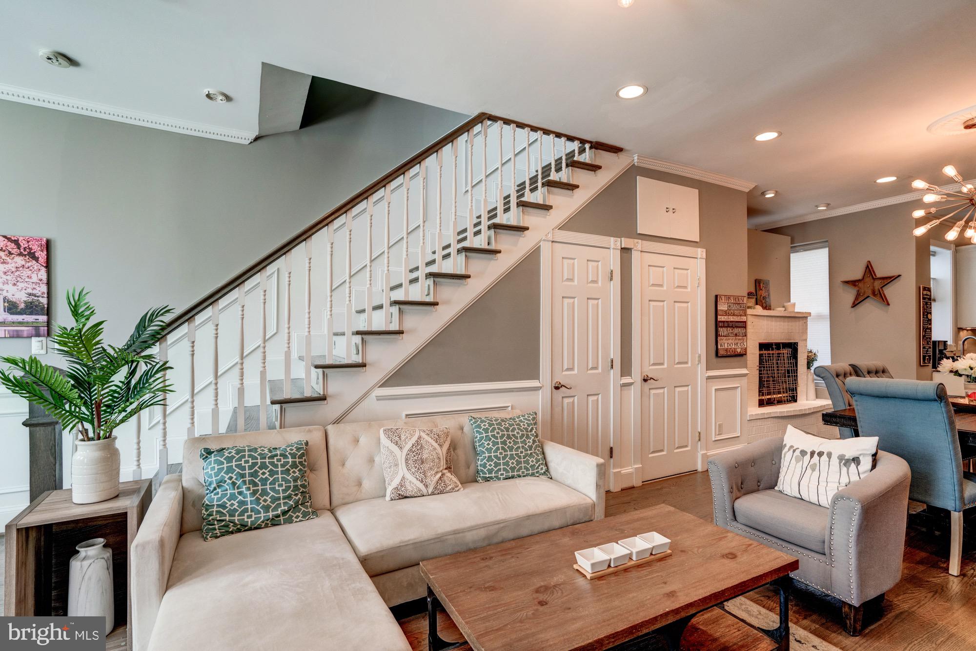 1016 G Street Southeast Washington, DC 20003 - Photo 7 of 56 a living room with furniture and wooden floor