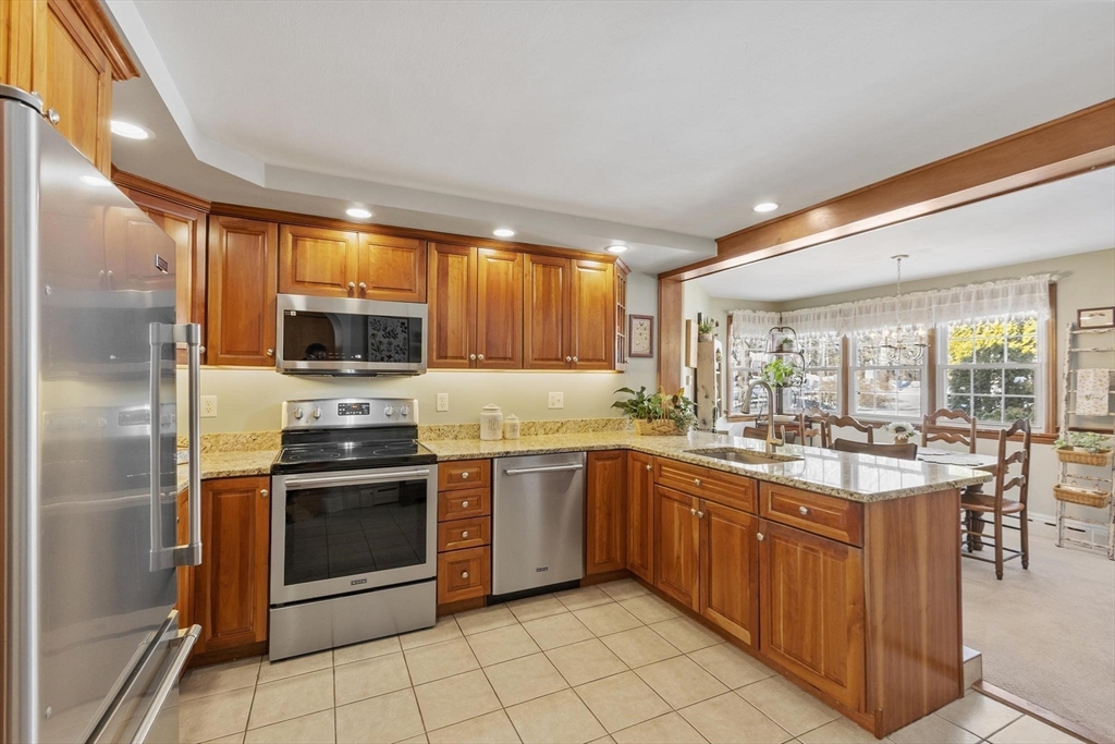 38 Knower Road Westminster, MA 01473 - Photo 18 of 40 a kitchen with stainless steel appliances granite countertop a sink and cabinets