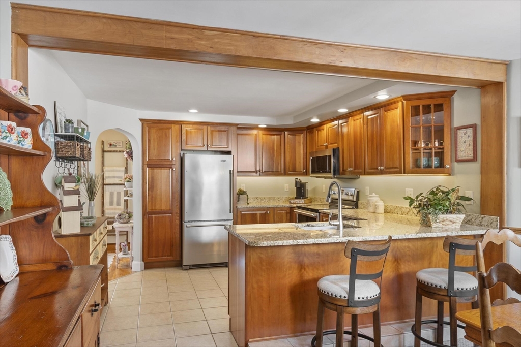 38 Knower Road Westminster, MA 01473 - Photo 20 of 40 a kitchen with stainless steel appliances granite countertop a sink and a refrigerator