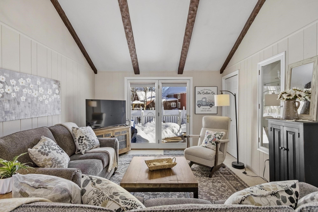 38 Knower Road Westminster, MA 01473 - Photo 29 of 40 a living room with furniture fireplace and a flat screen tv