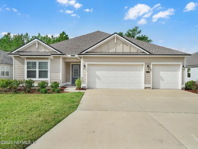 a front view of a house with yard