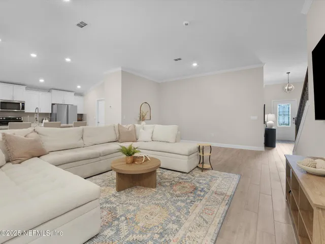 a living room with furniture and a couch