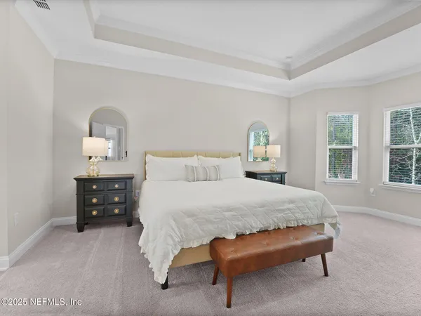 a bed room with a bed and a window