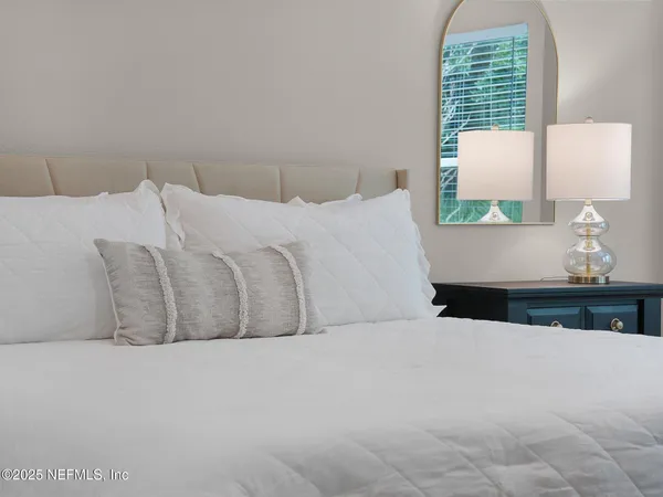 a bedroom with a bed and window