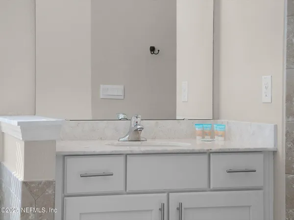 a bathroom with a sink and a mirror