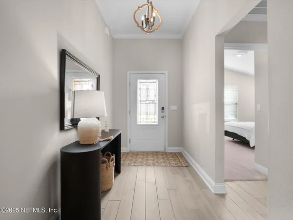 a very nice looking room with wooden floor and a bathroom