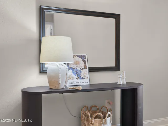 a bathroom with a mirror and a sink