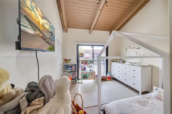 a bathroom with a double vanity sink and mirror with shower
