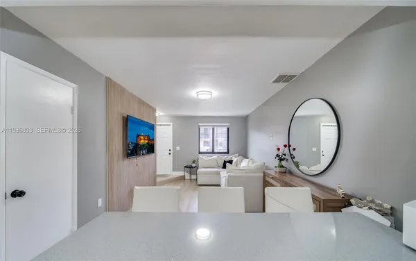 a kitchen with sink a refrigerator and cabinets