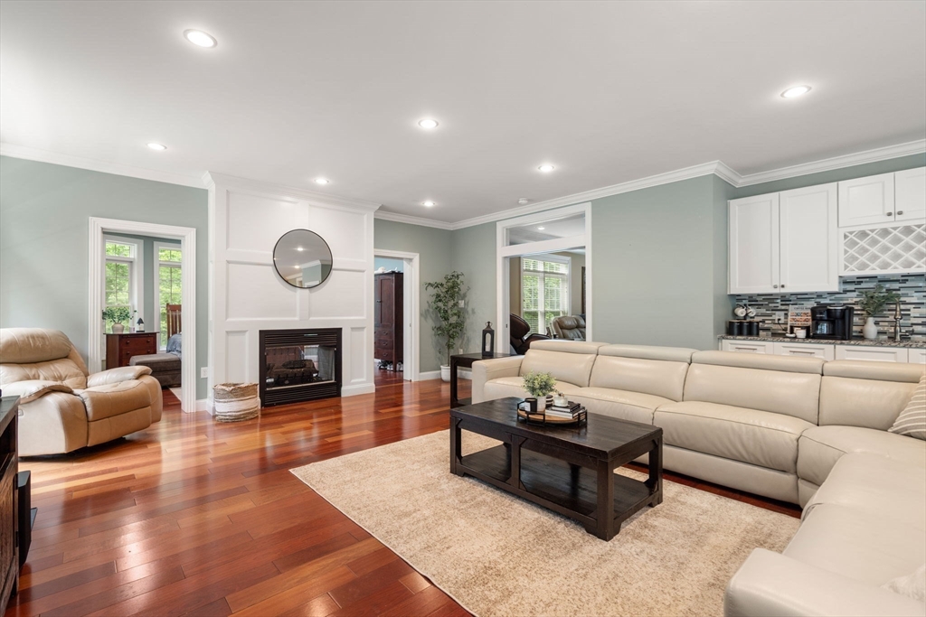 24 Wayside Inn Road Framingham, MA 01701 - Photo 13 of 38 a living room with furniture and a fireplace